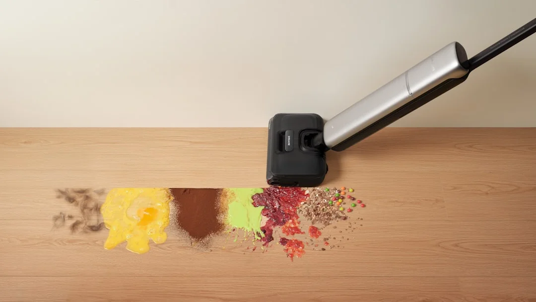 Person using spray bottle and cloth to clean a kitchen shelf, helping maintain hygiene and cleanliness.